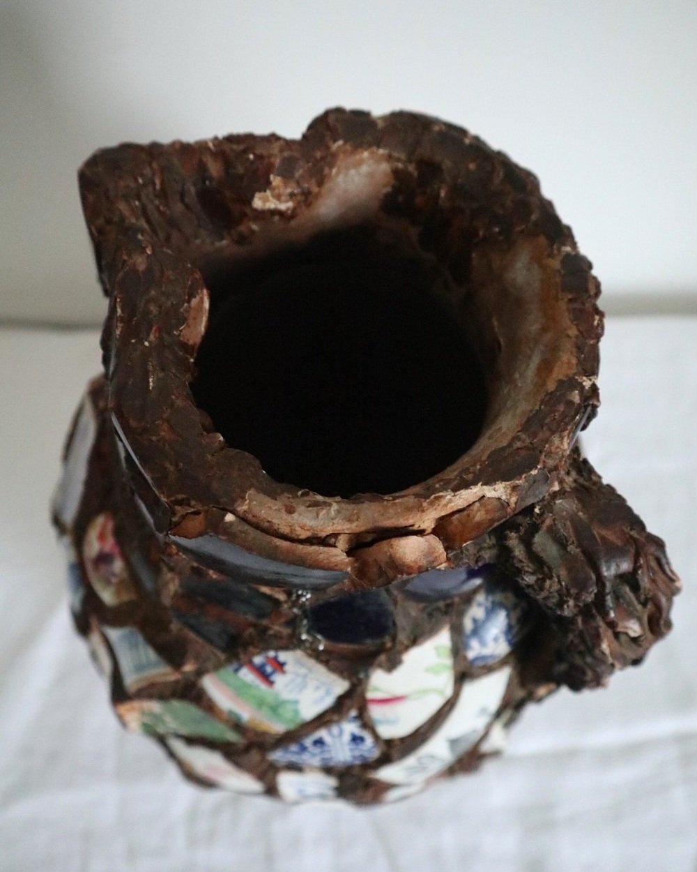 Large French pique assiette mosaic pottery jug with handle.