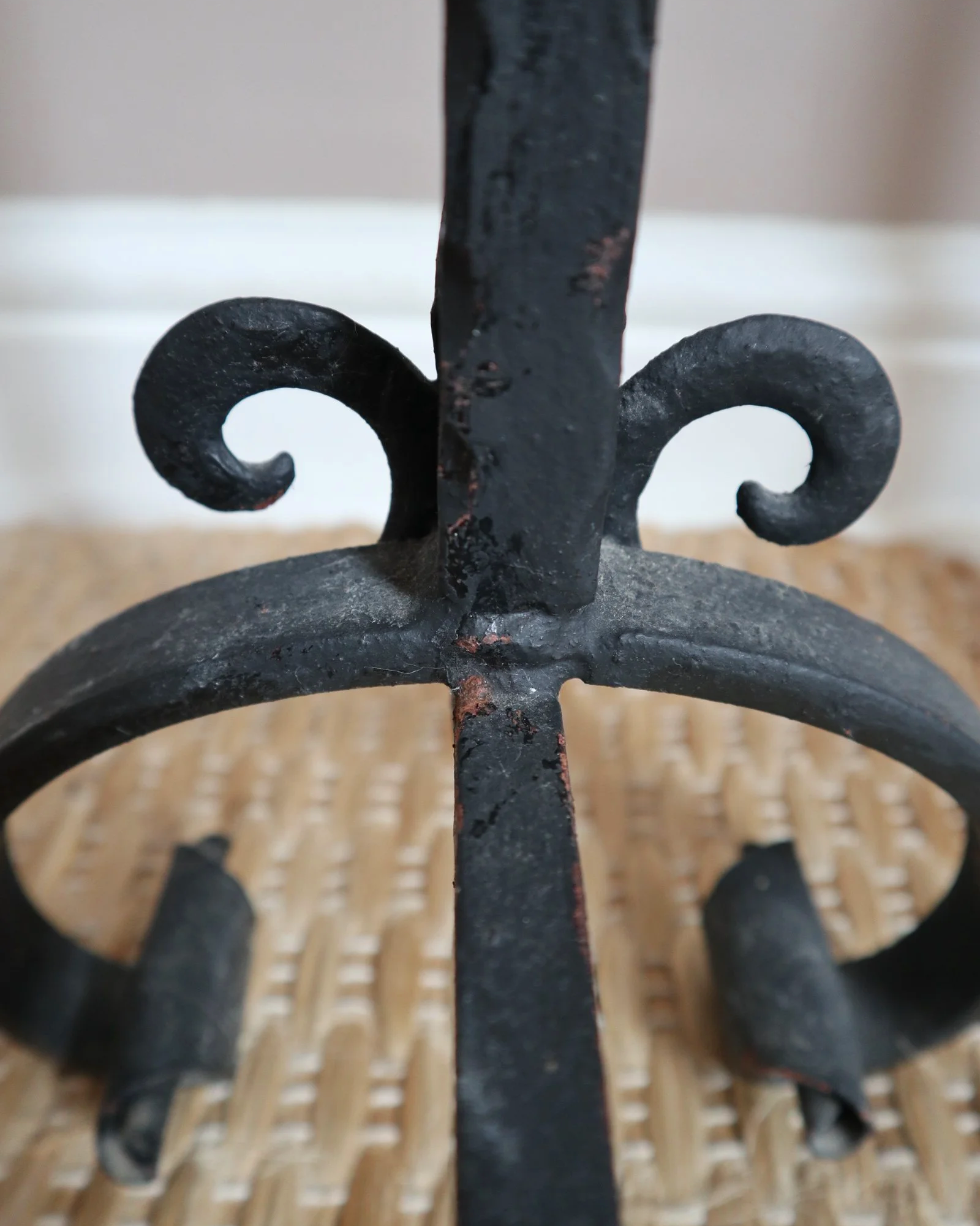 Pair of black wrought-iron andirons or firedogs featuring stylized rooster finials, circa mid-20th century.