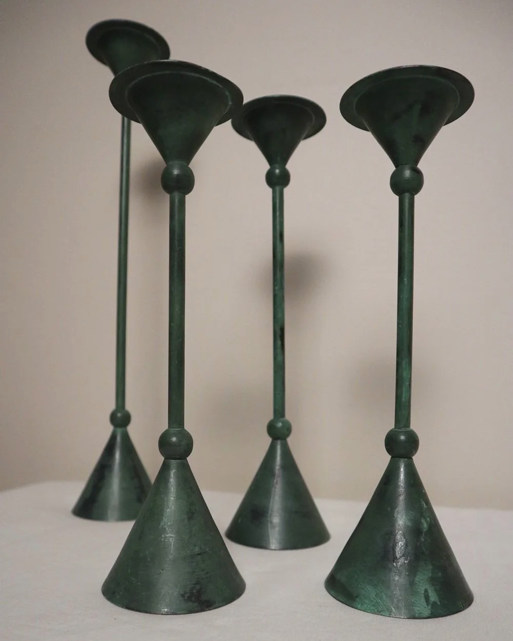 Set of 4 Postmodern verdigris metal candleholders, circa 1980s. In the Memphis style of Christian de Beaumont.