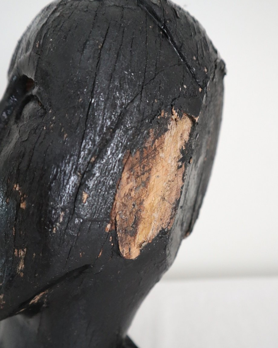 Vintage hand carved black painted wooden sculpture of male head. Age unknown.