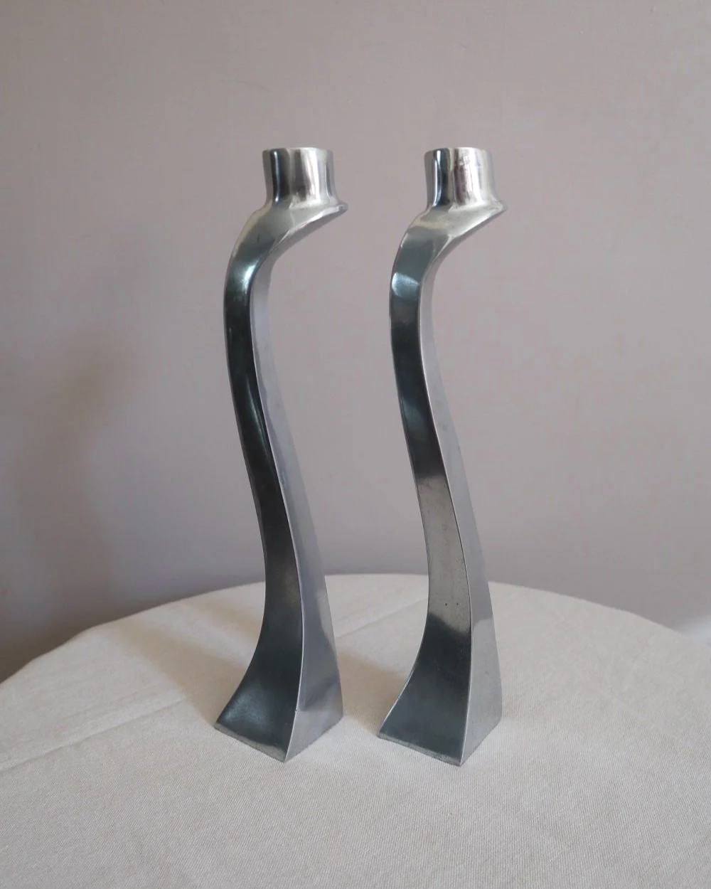 Pair of tall, elegant 1980s Modernist cast aluminium candleholders, likely 'Nessie' style designed by Matthew Hilton.