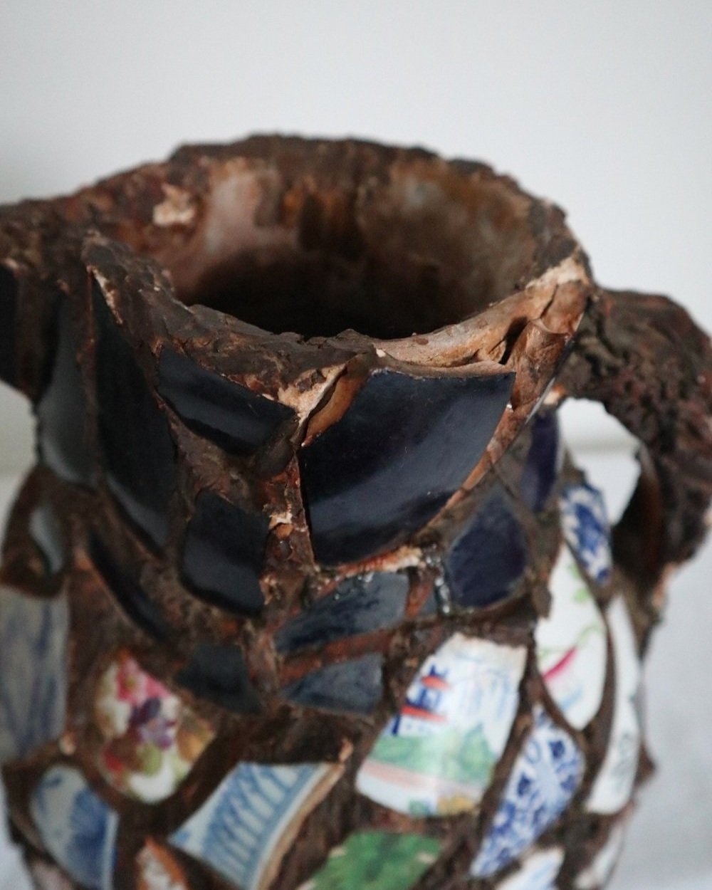 Large French pique assiette mosaic pottery jug with handle.