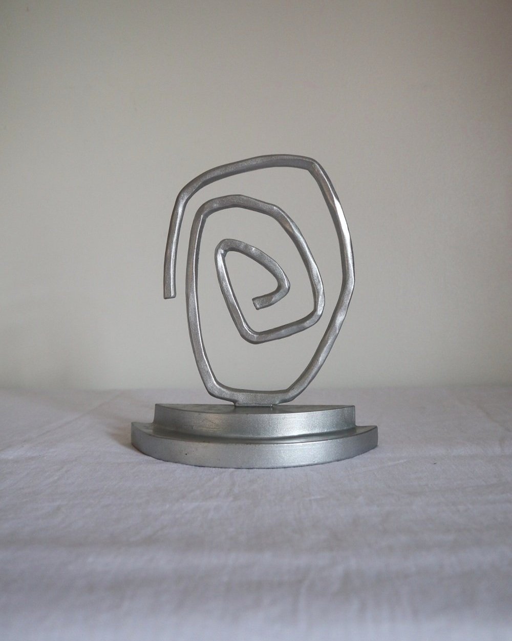 Pair of Postmodern sprayed silver spiral bookends, circa 1990s.