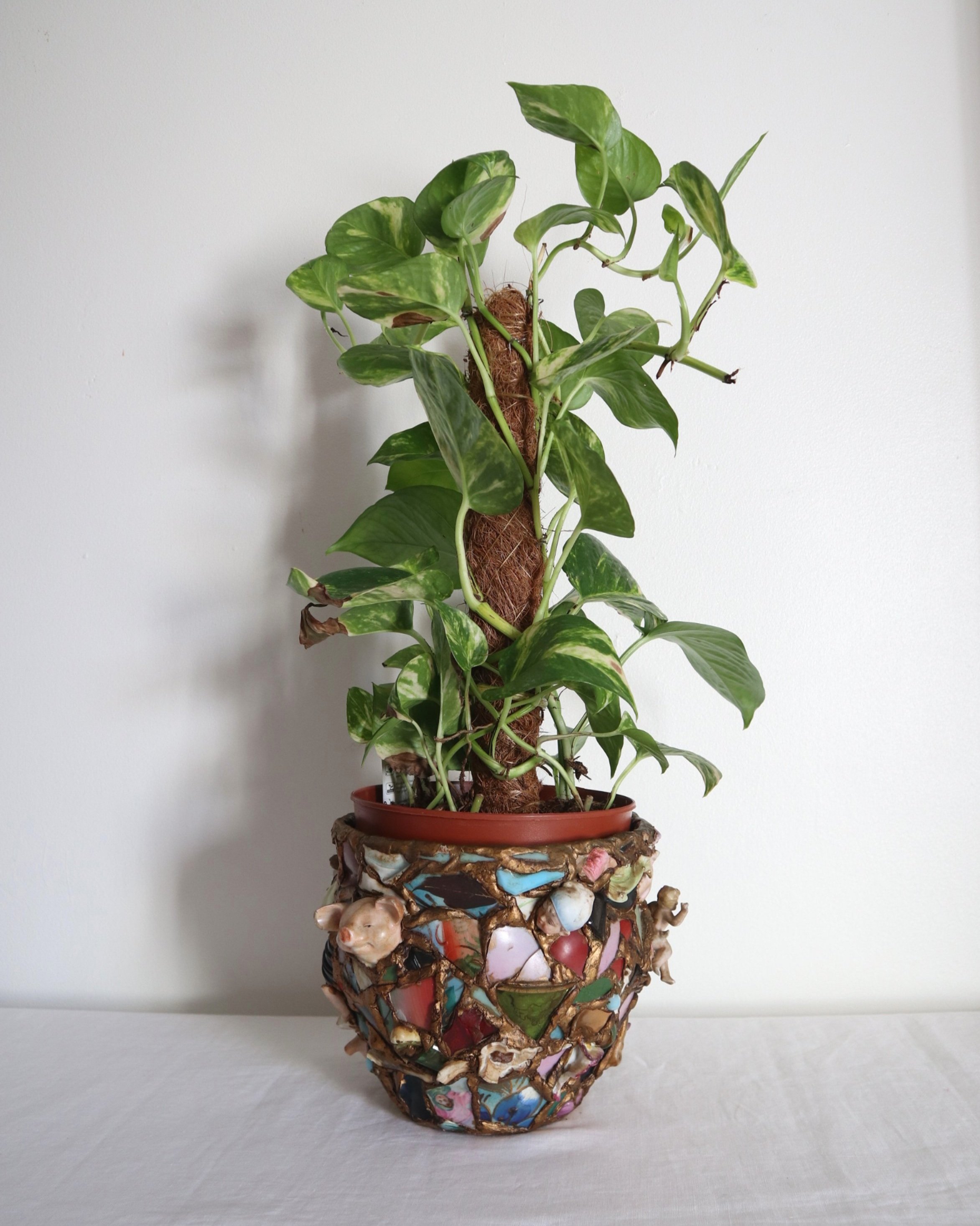 Quirky and characterful pique assiette mosaic pottery plant pot.
