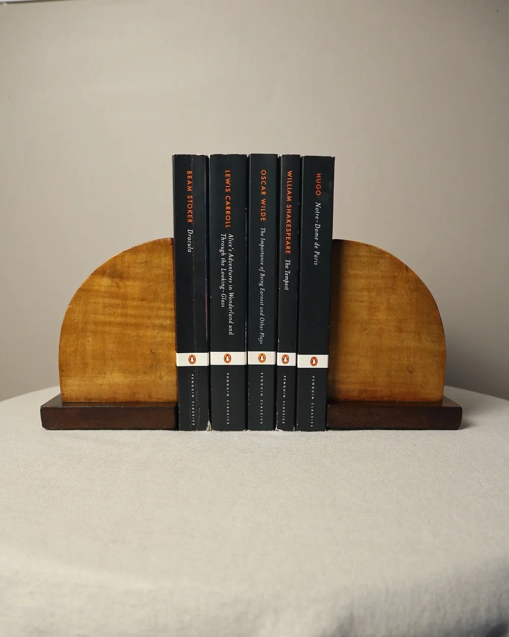 Vintage Art Deco style two tone arched wooden bookends.