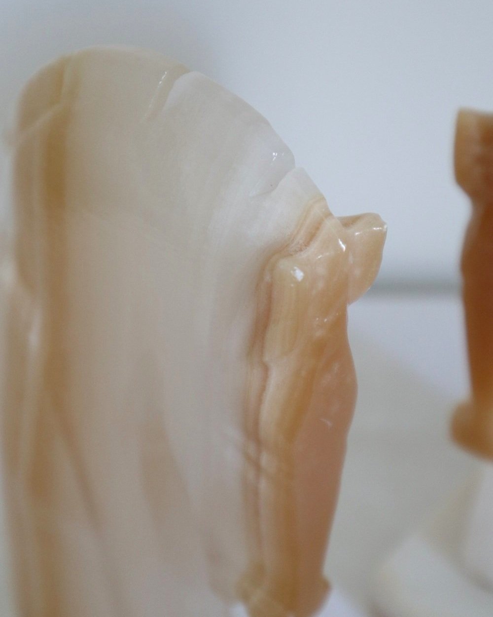 pair of tall white onyx Trojan horse head bookends.