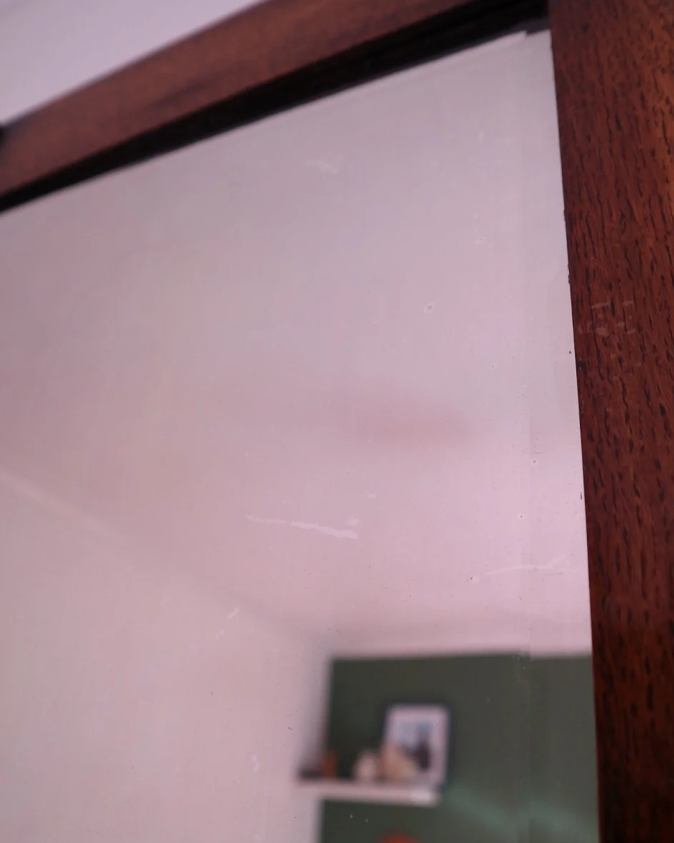 Arts & Crafts square wooden framed mirror with carved corner detailing. Circa 1930s.