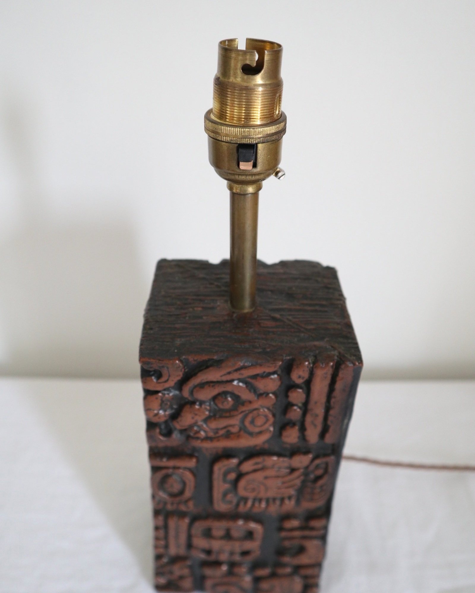 Mid century very heavy Brutalist Aztec style cast resin table lamp with metallic bronze finish.