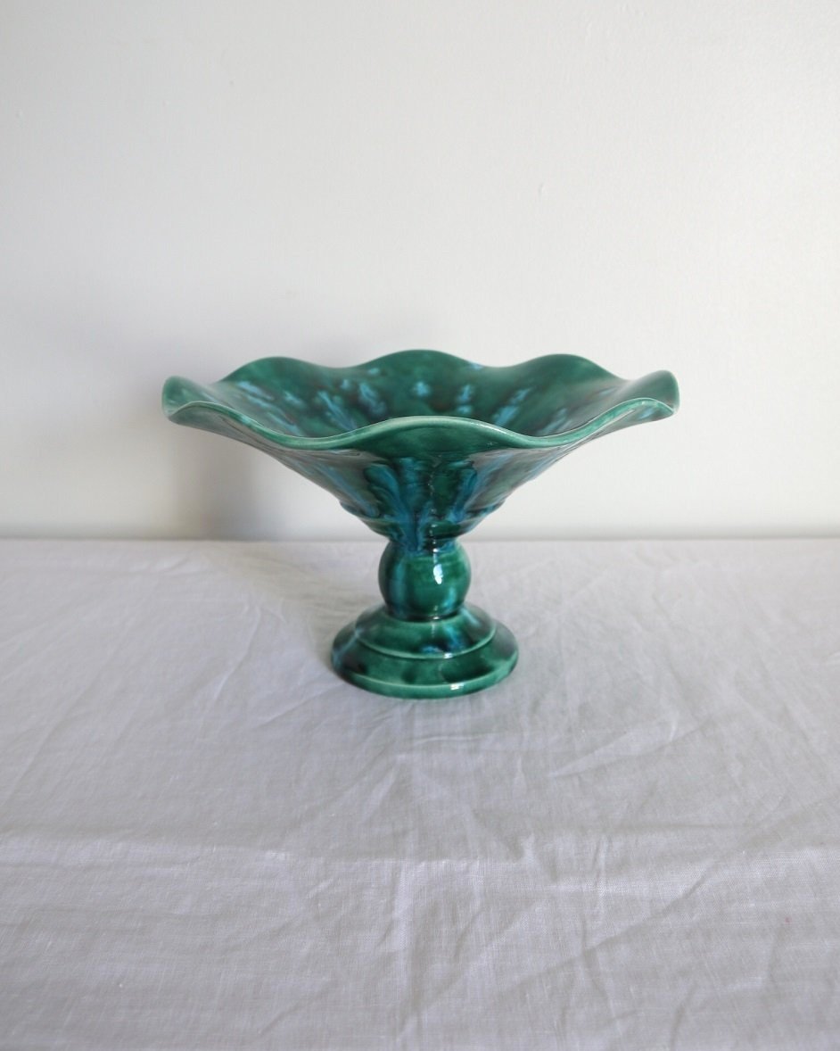 Studio pottery vibrant blue green shiny drip glaze pedestal cake stand / dish with wavy edge.
