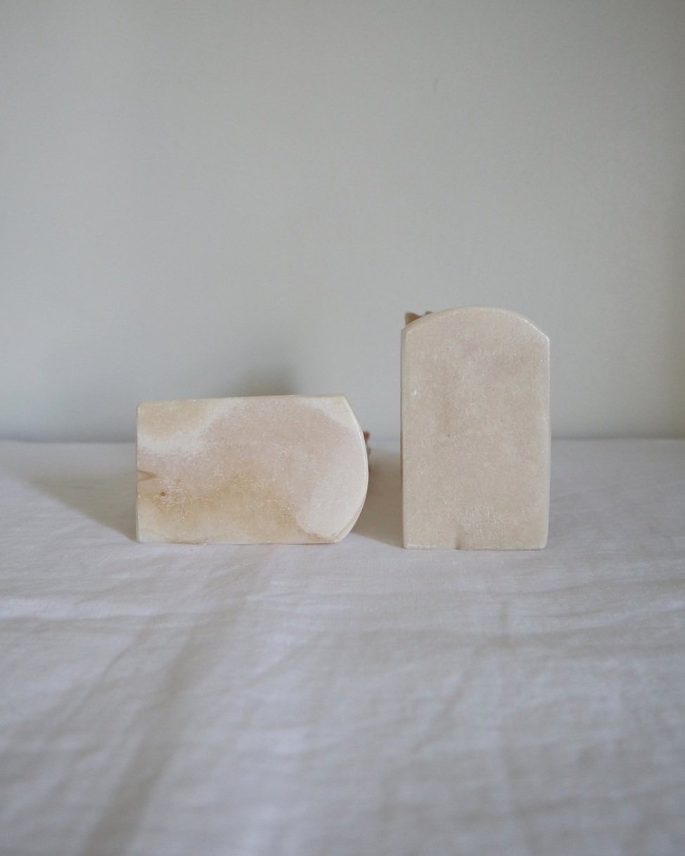 pair of tall white onyx Trojan horse head bookends.