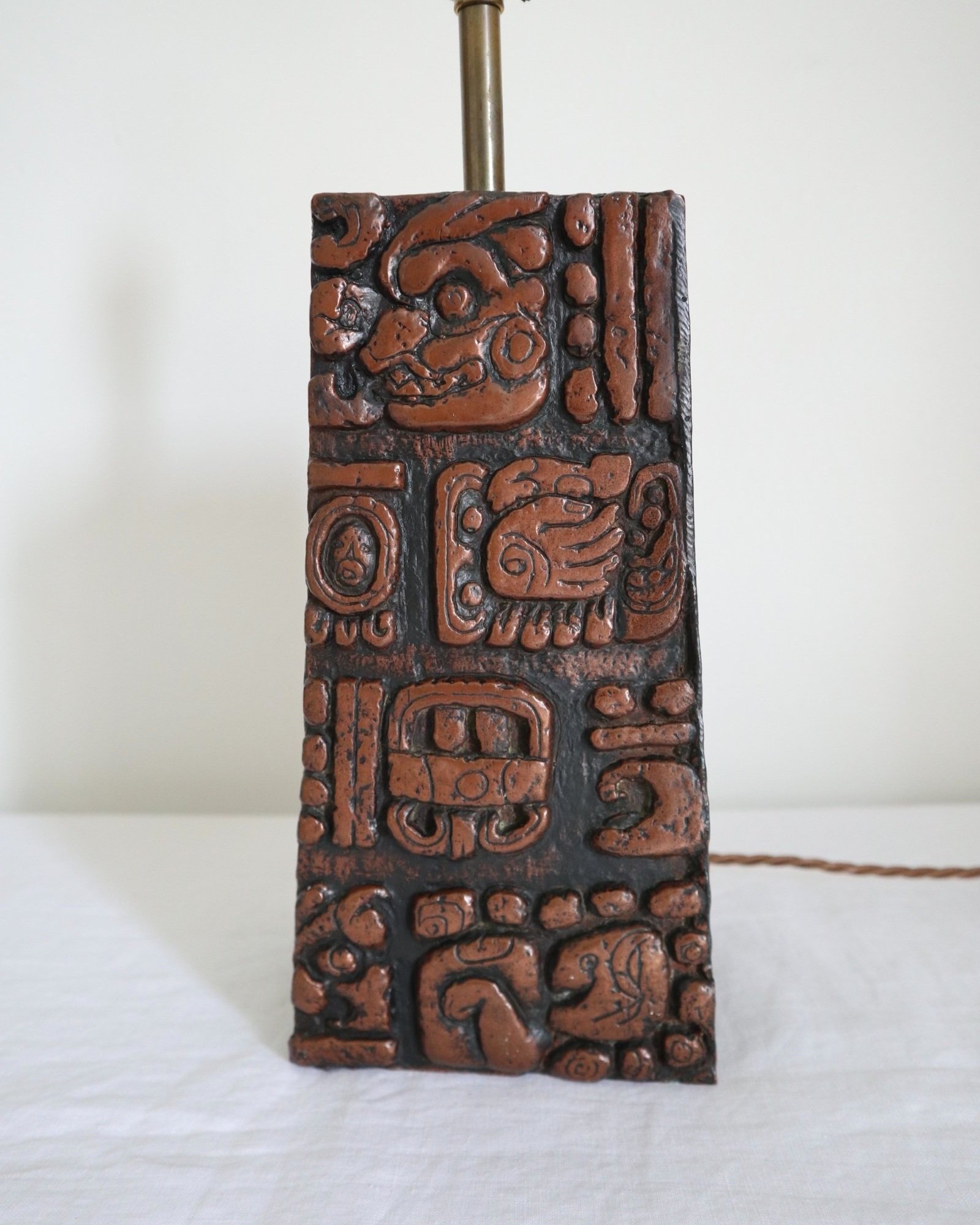 Mid century very heavy Brutalist Aztec style cast resin table lamp with metallic bronze finish.