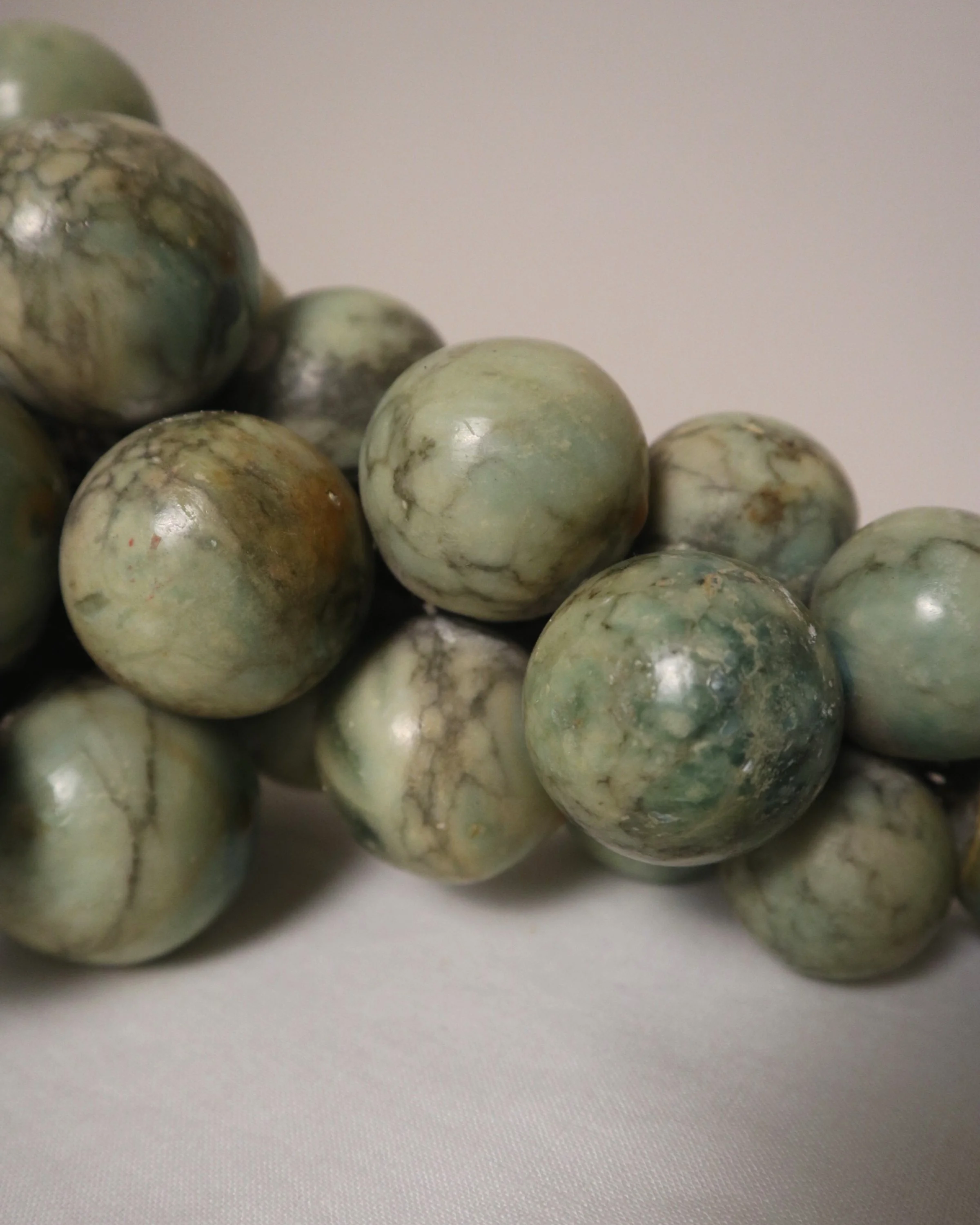 Large 1970s cluster of green alabaster grapes with real vine stem.