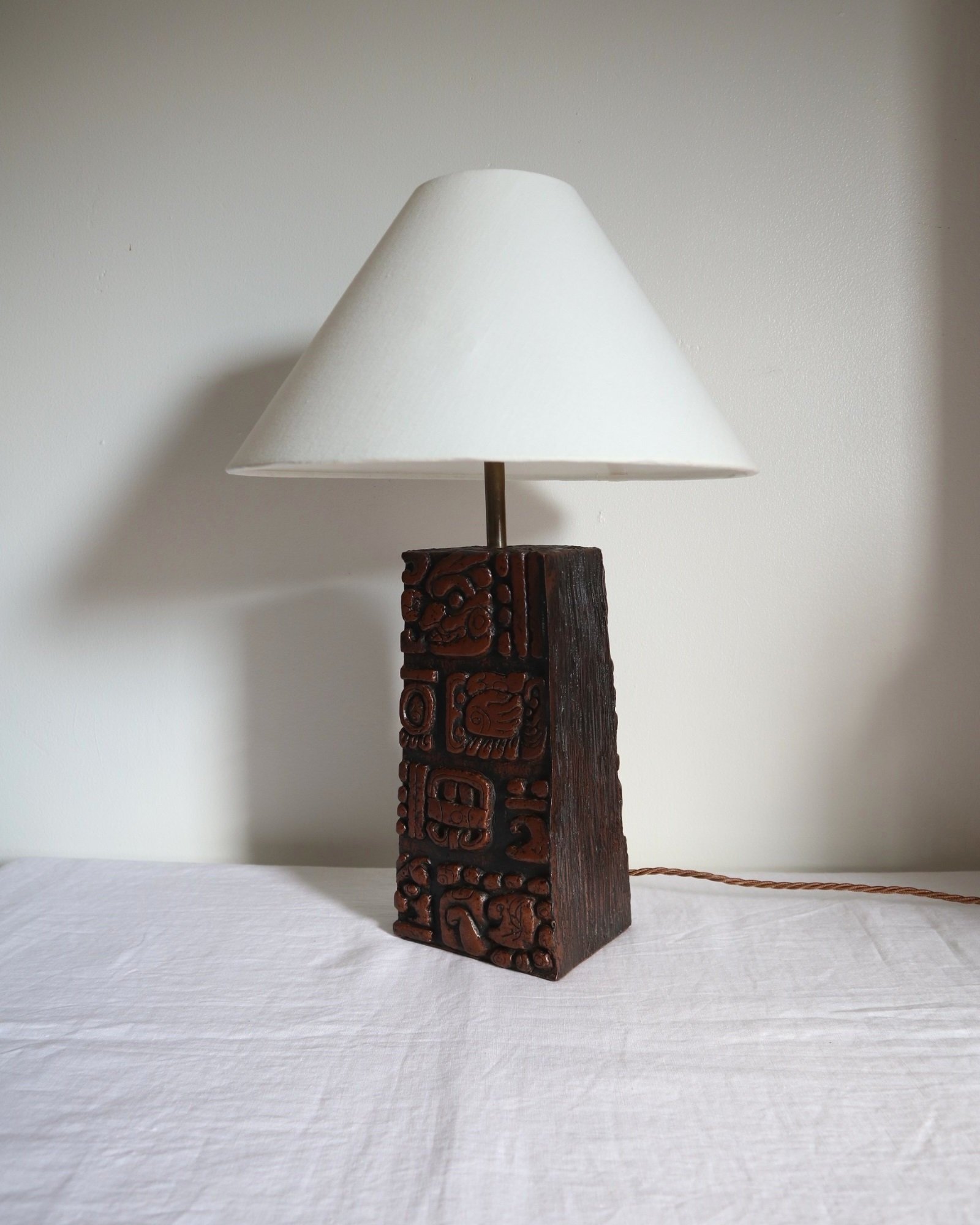 Mid century very heavy Brutalist Aztec style cast resin table lamp with metallic bronze finish.
