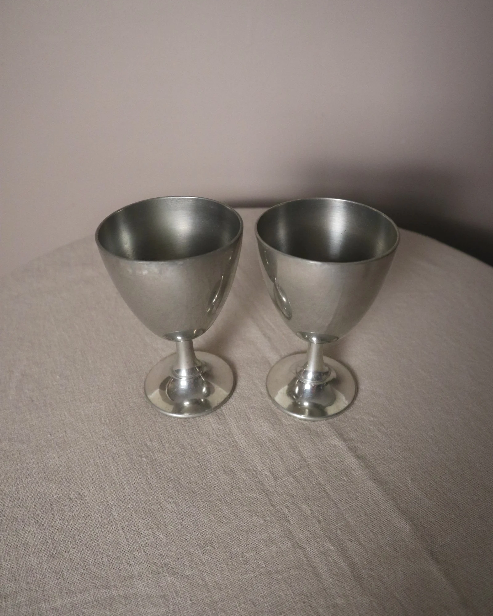 Pair of British P.H. Vogel & Co pewter goblets. Made in England. Circa 1970s.