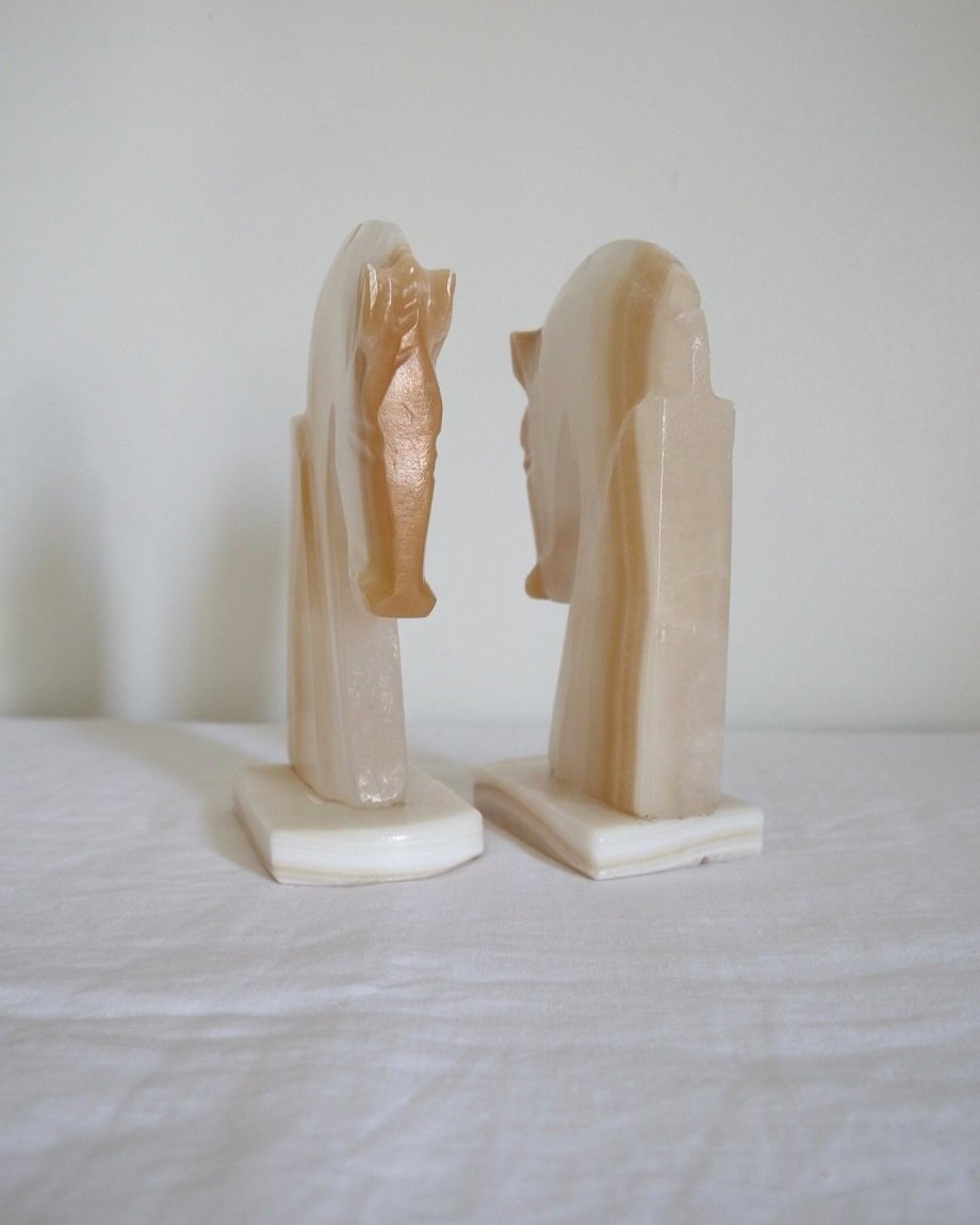 pair of tall white onyx Trojan horse head bookends.