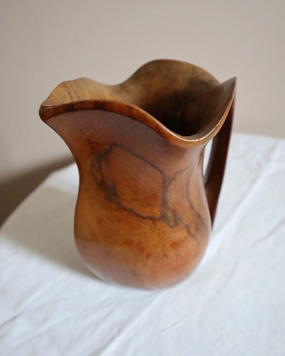 Small mid century hand carved sculptural olivewood jug in the style of Alexandre Noll. Circa 1960s.