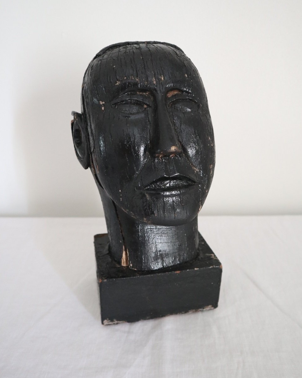 Vintage hand carved black painted wooden sculpture of male head. Age unknown.