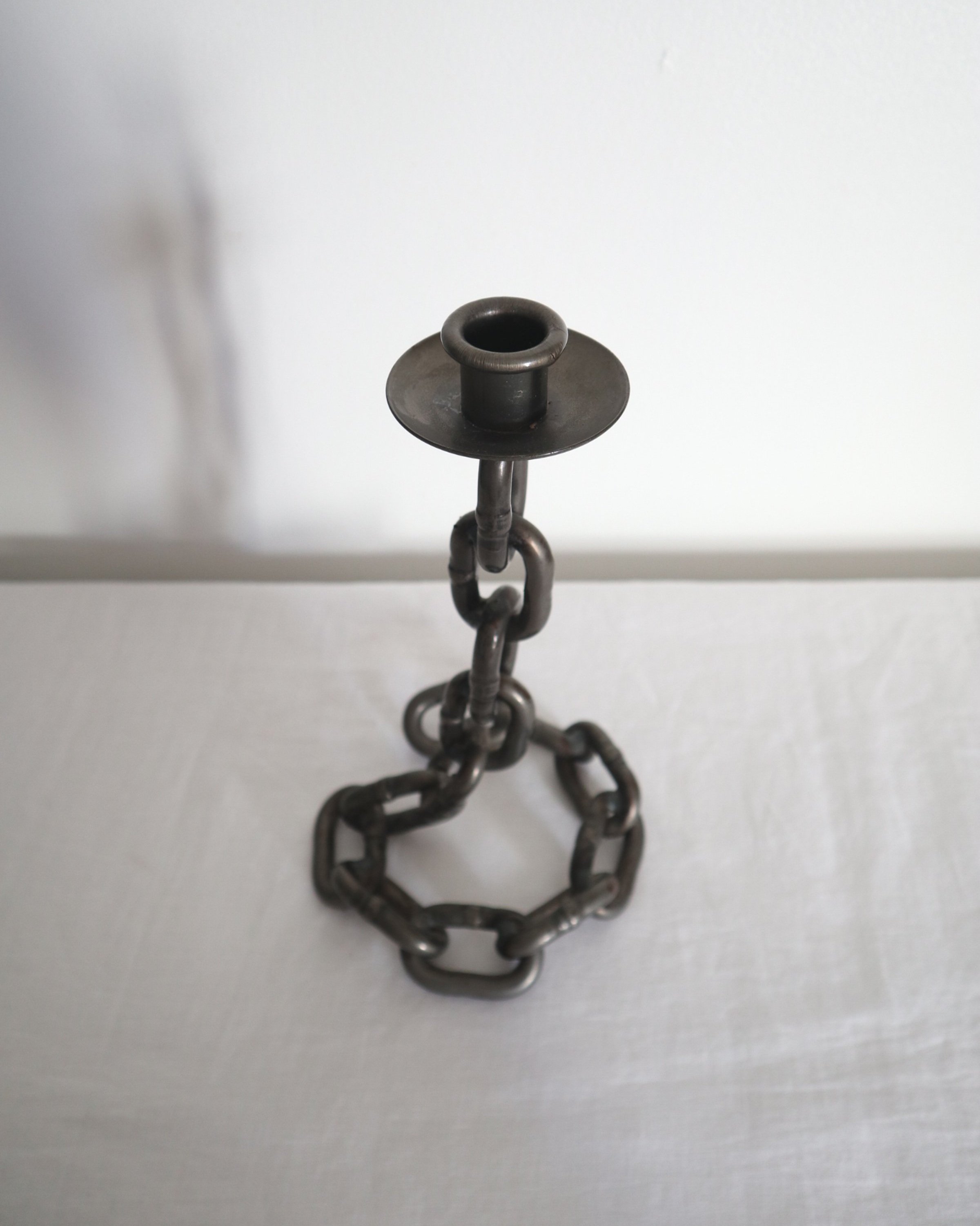 Heavy, vintage Brutalist chain link candlestick made from lacquered grey forged iron.