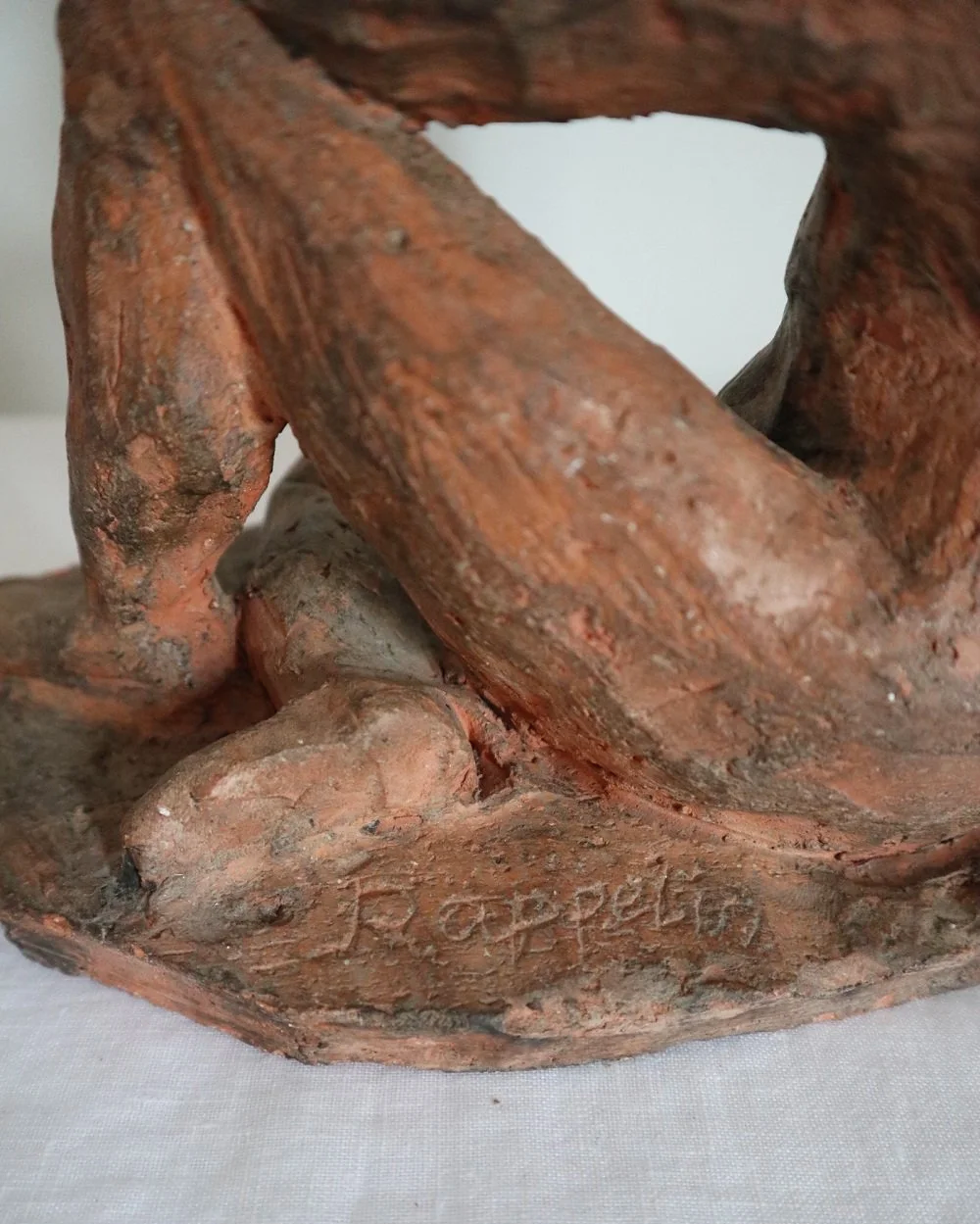 Heavy handmade studio pottery textured sculpture of seated nude woman.