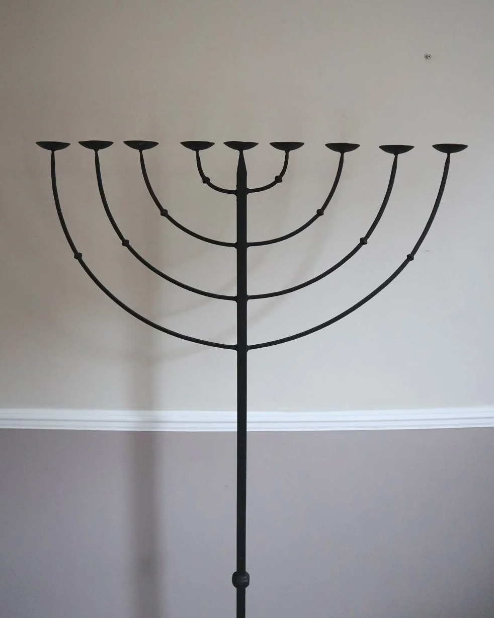 Large Brutalist wrought iron 9 arm Hanukkah candleholder. Circa 1970s.