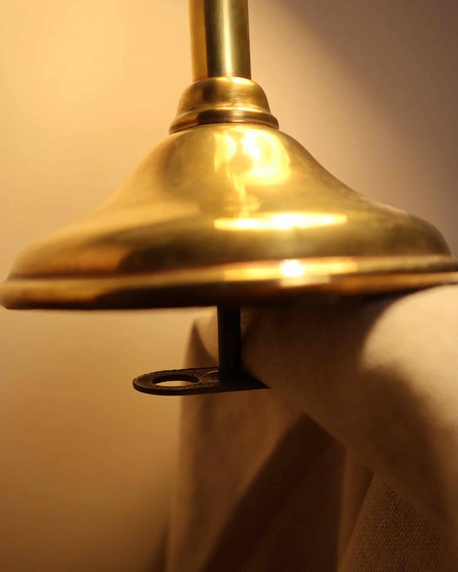 Small, vintage adjustable brass worker's desk lamp. Can be freestanding or attached to the edge of a workbench etc with clamp.