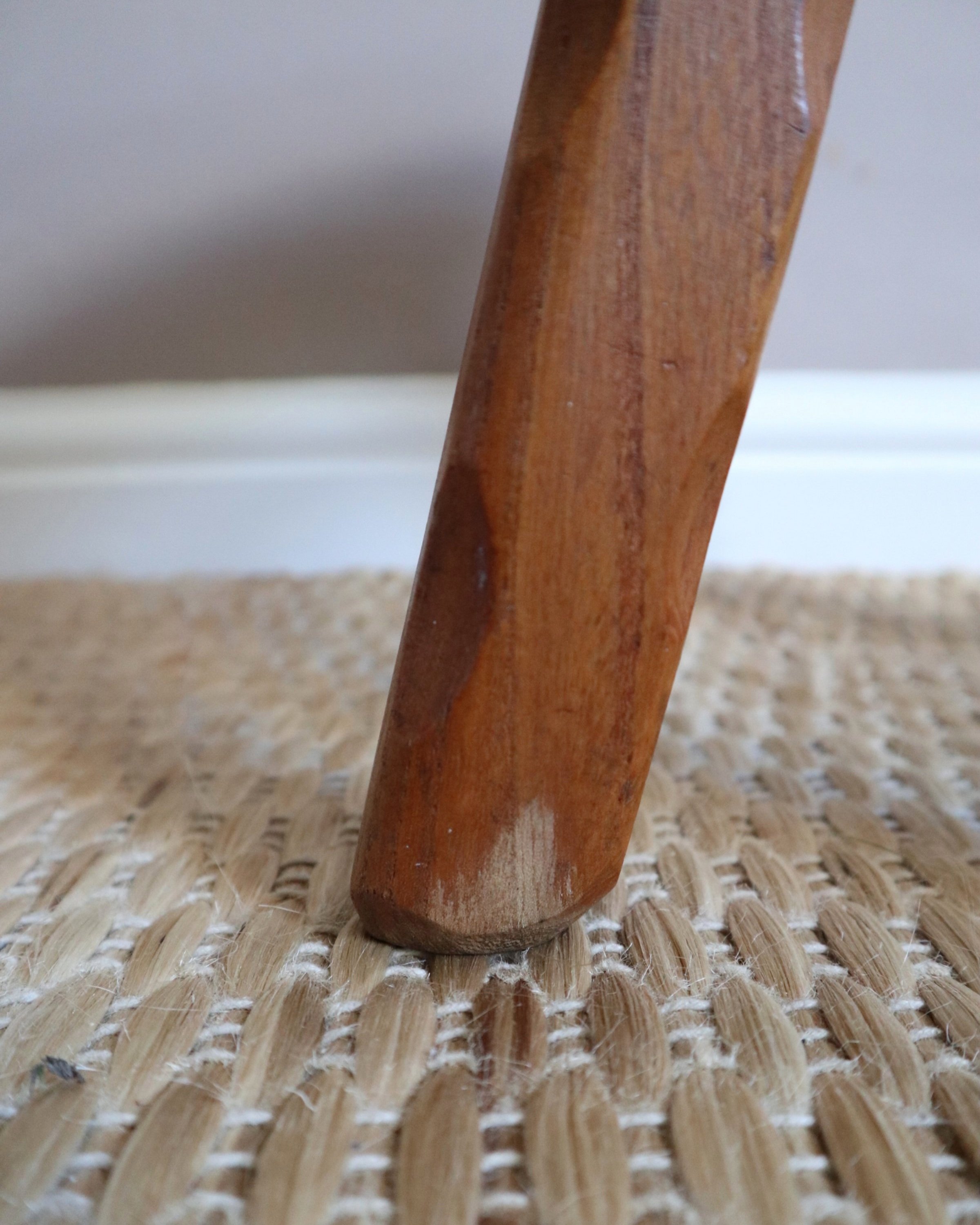 Vintage rustic handmade warm wooden tripod stool with carved legs. Stamped 'John Chapman Woodcrafts Northwood'.