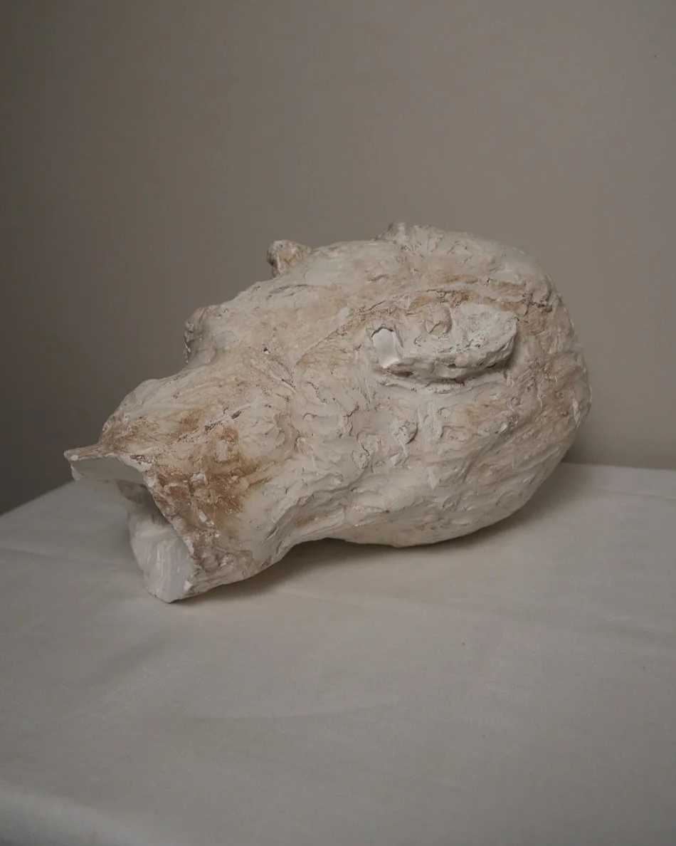 Large, heavy off white textured plaster sculpture of man's head in abstract style. Unknown age.