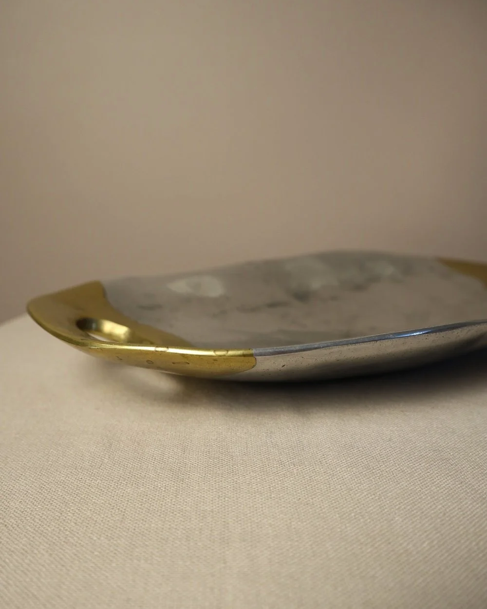 Brutalist heavy cast aluminium and brass decorative shallow bowl /dish by David Marshall, circa 1970s.