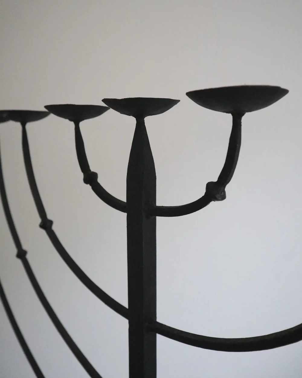 Large Brutalist wrought iron 9 arm Hanukkah candleholder. Circa 1970s.