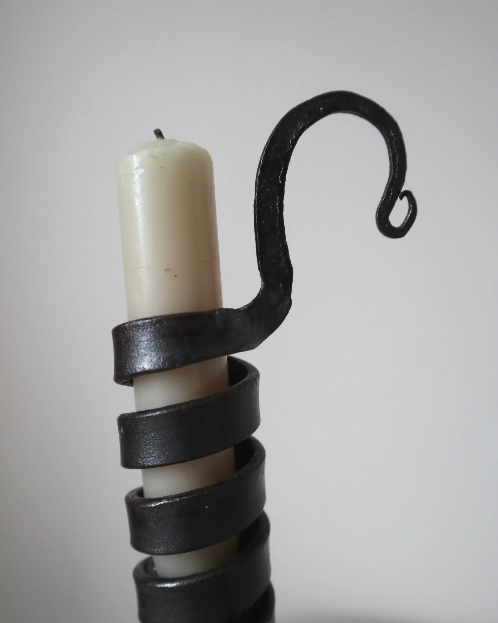 Vintage wrought iron ‘rat de cave’ style candleholder with turning spiral mechanism which raises the candle as it burns lower.