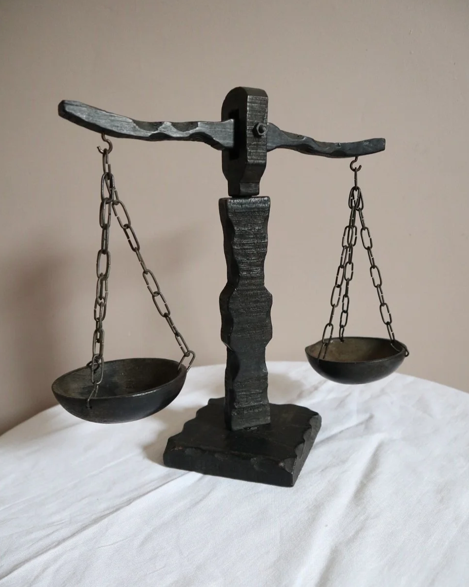 Vintage Spanish rustic carved wooden scales with circular hanging trays on chains.