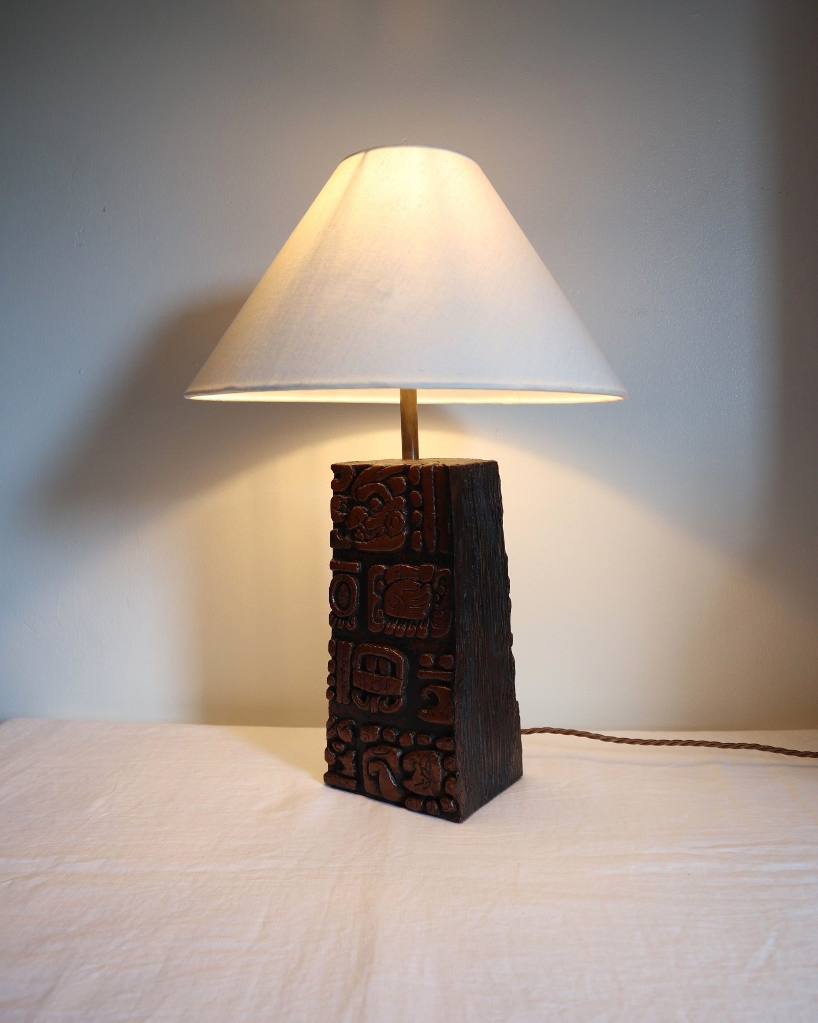 Mid century very heavy Brutalist Aztec style cast resin table lamp with metallic bronze finish.