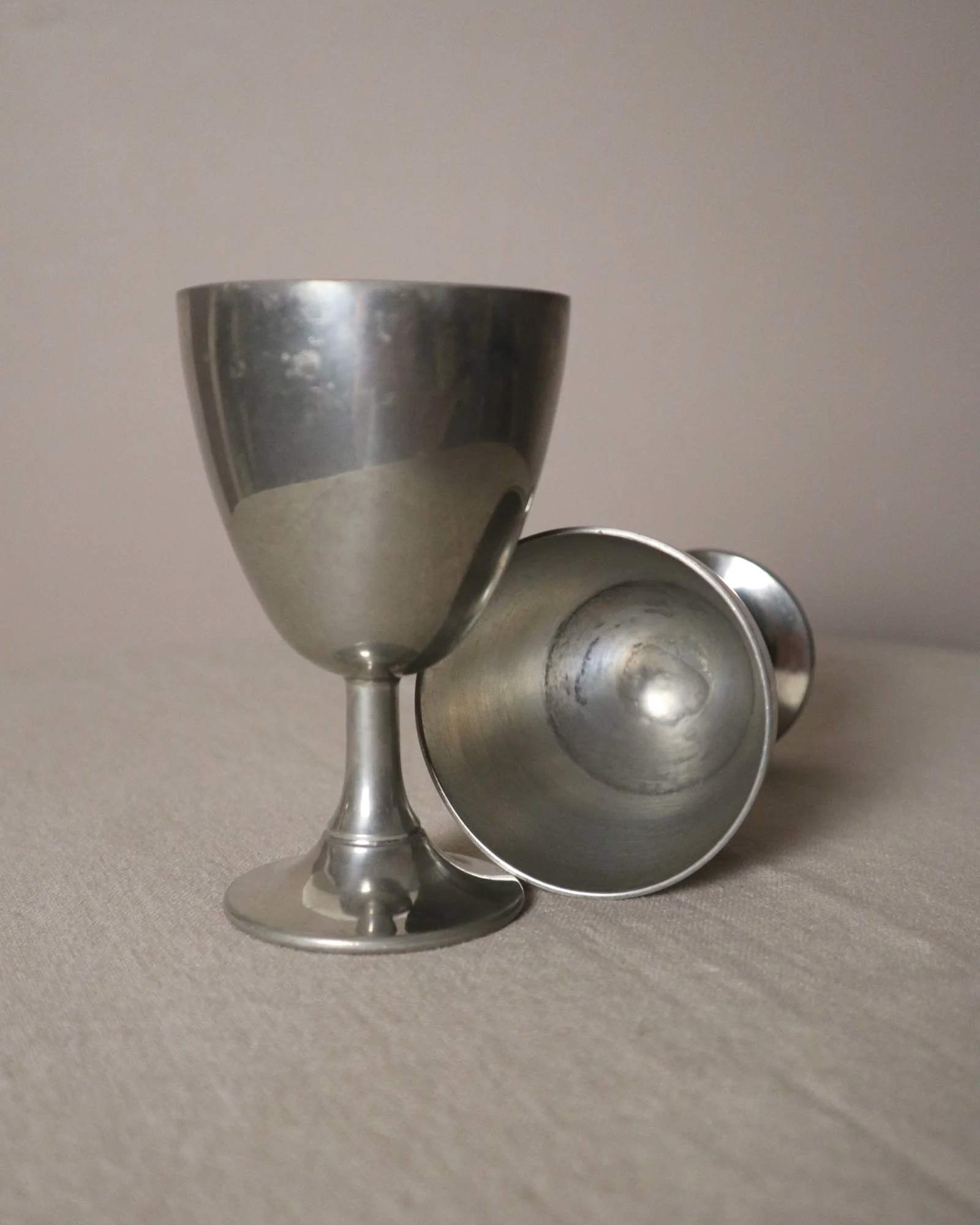Pair of British P.H. Vogel & Co pewter goblets. Made in England. Circa 1970s.