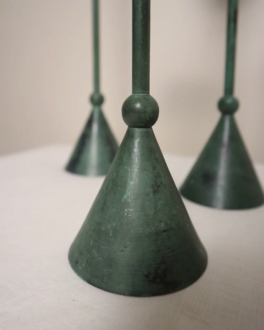 Set of 4 Postmodern verdigris metal candleholders, circa 1980s. In the Memphis style of Christian de Beaumont.