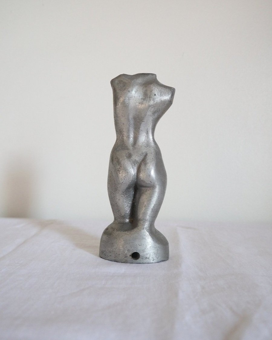 Modernist cast aluminium naked torso sculpture.