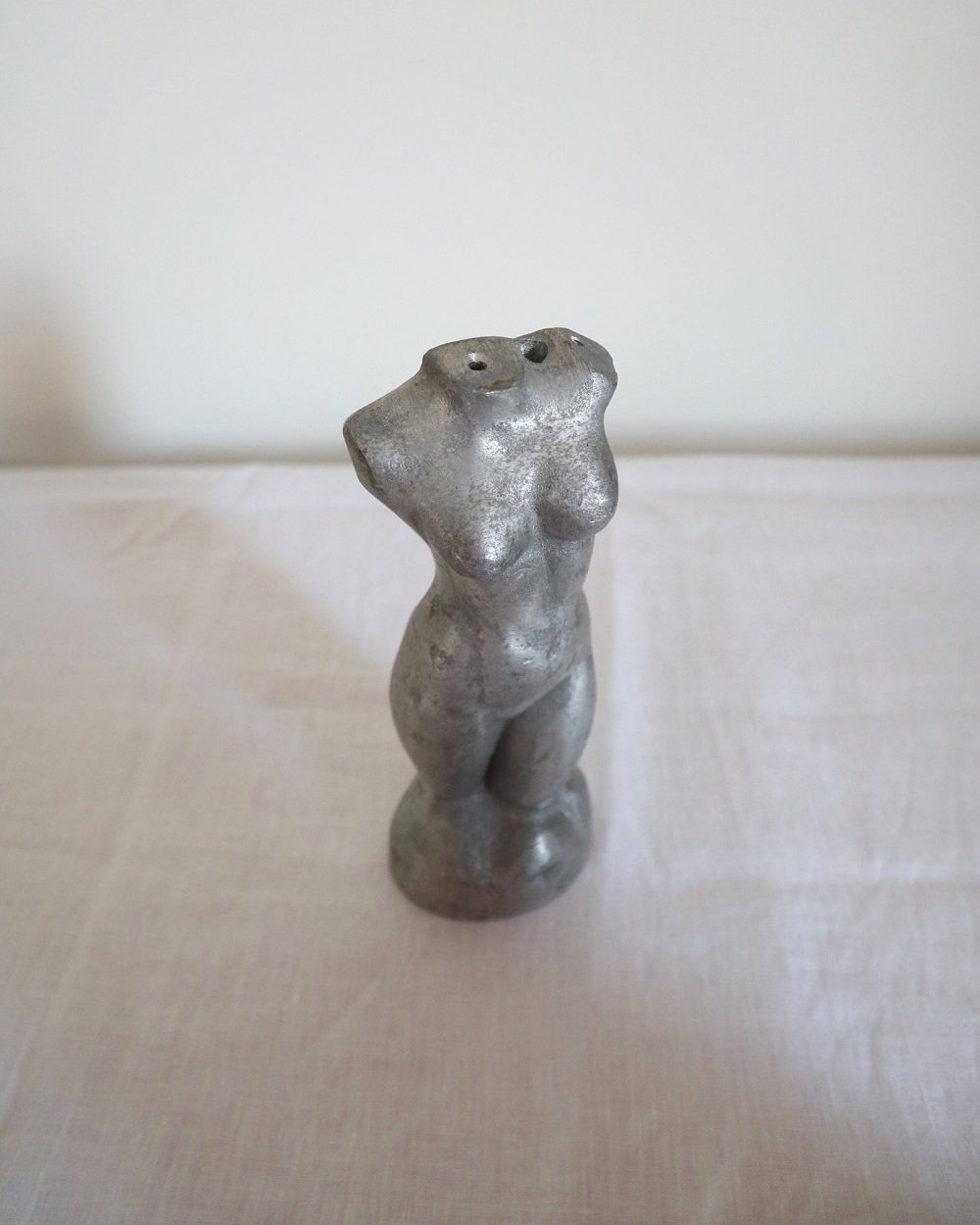 Modernist cast aluminium naked torso sculpture.