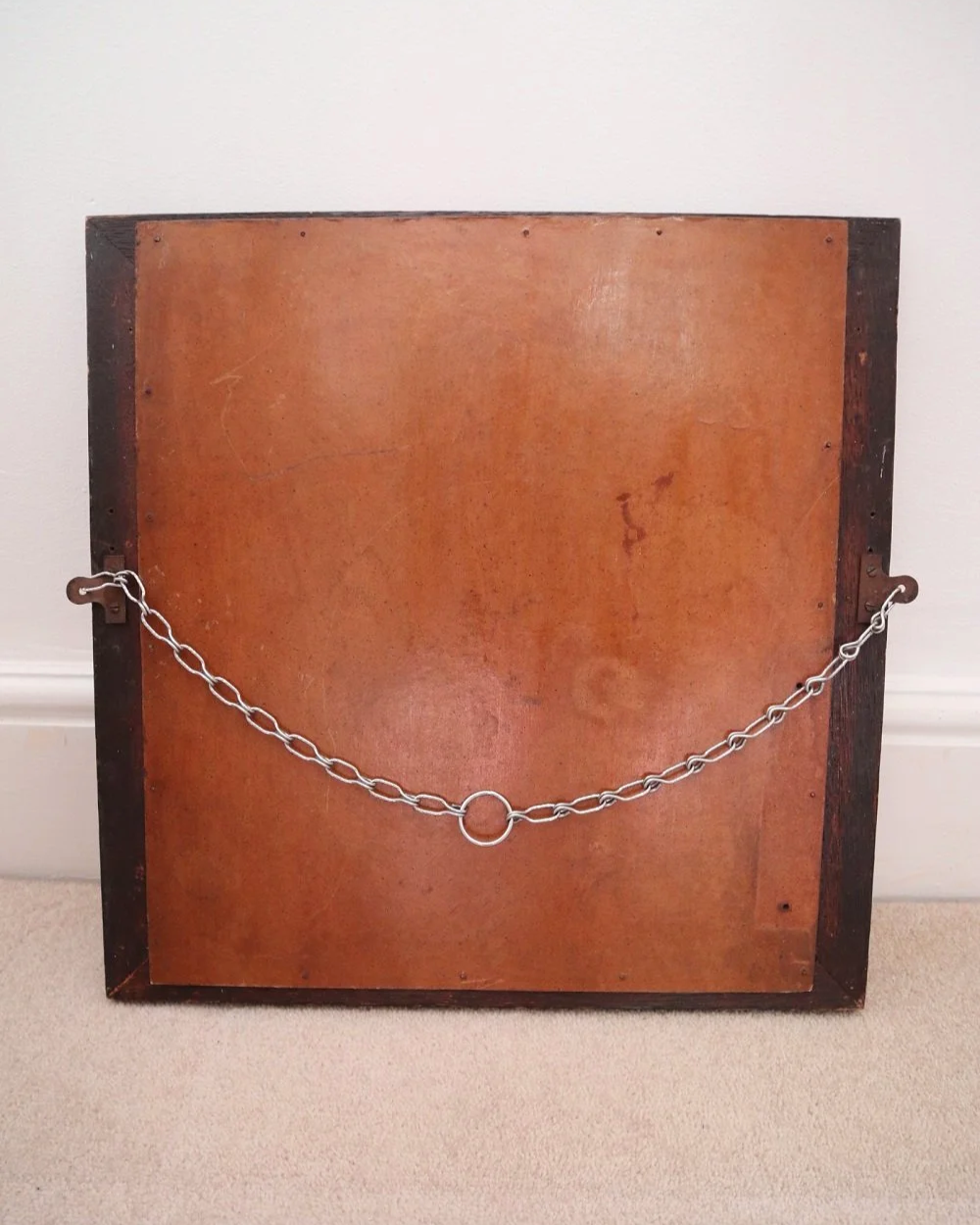 Arts & Crafts square wooden framed mirror with carved corner detailing. Circa 1930s.