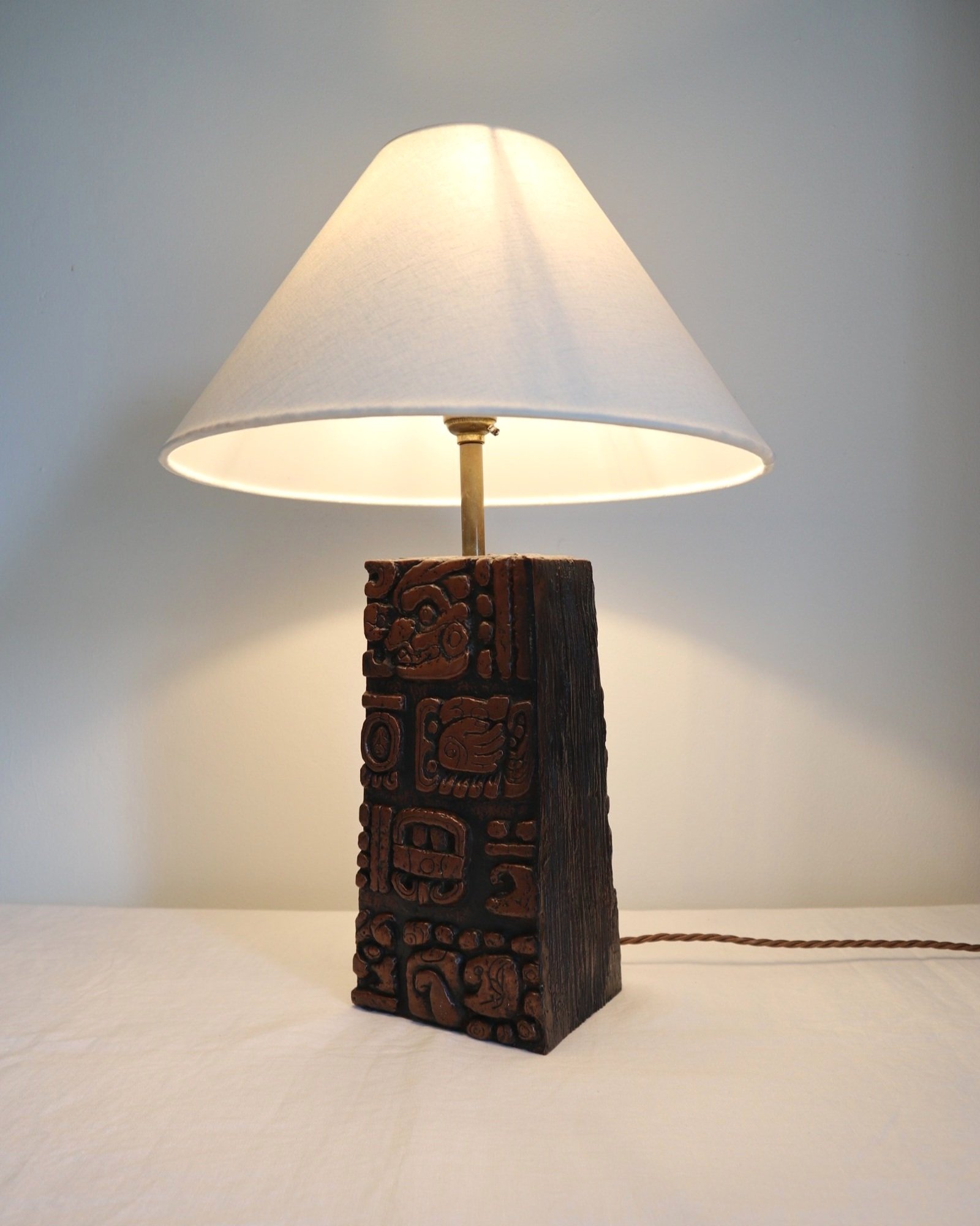Mid century very heavy Brutalist Aztec style cast resin table lamp with metallic bronze finish.
