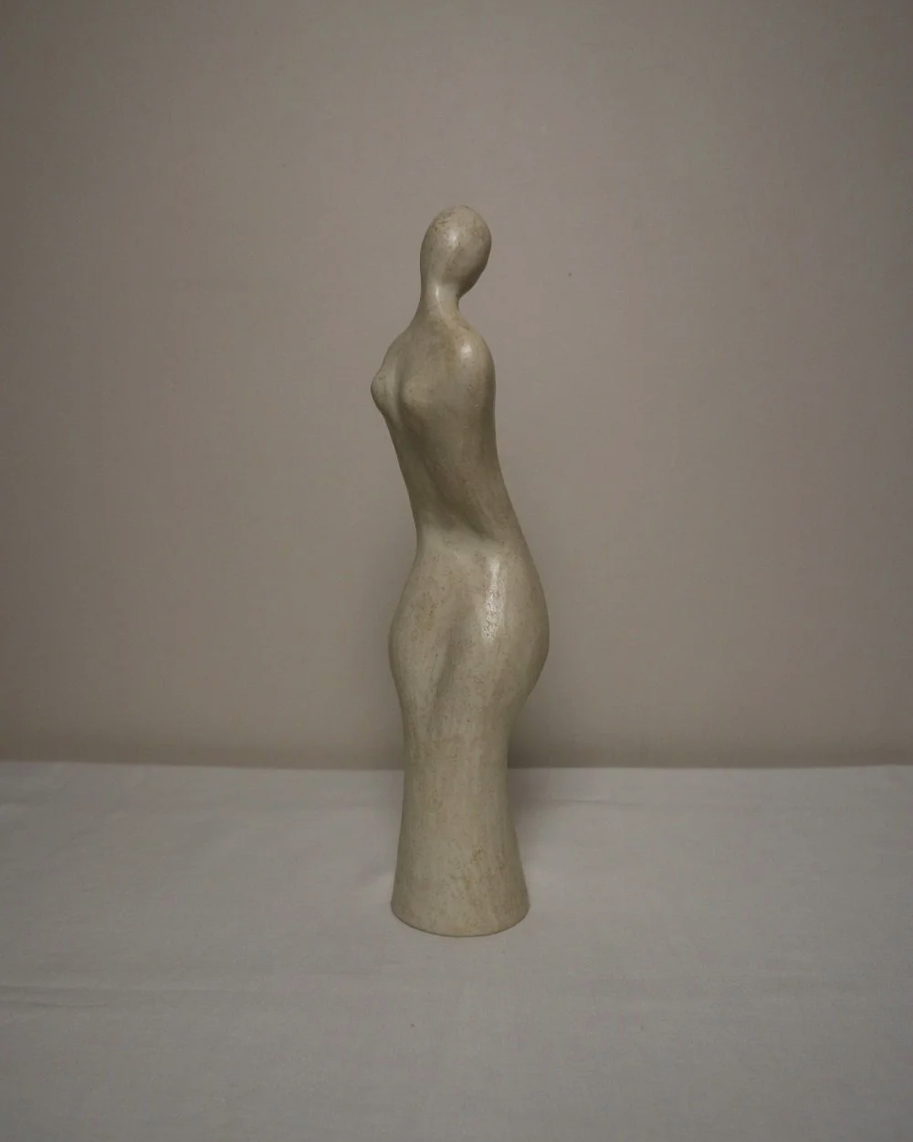 Set of three white ceramic abstract sculptures in the shape of the female form. Unknown age.  Signed 'R W Art / RoseWood Art'