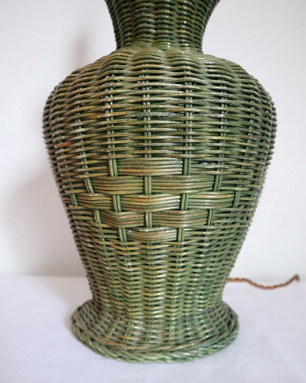 Vintage, large painted green woven wicker table lamp with new, vertical striped cotton lampshade.