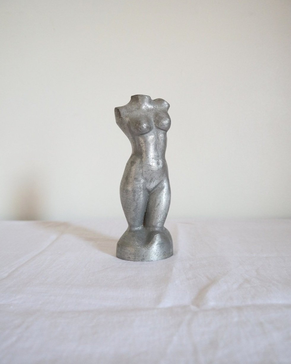 Modernist cast aluminium naked torso sculpture.
