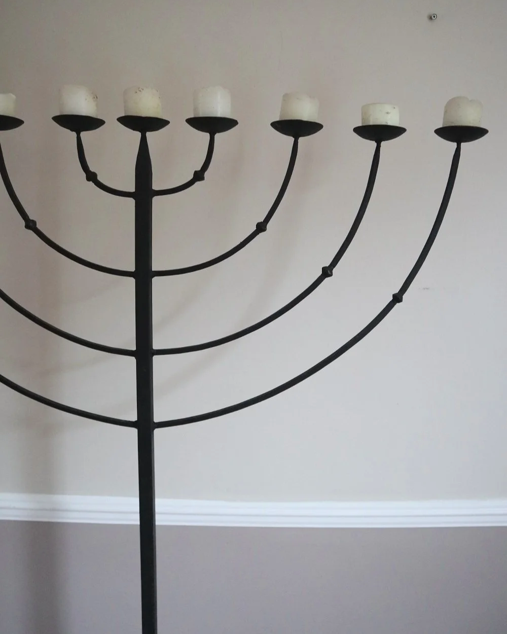 Large Brutalist wrought iron 9 arm Hanukkah candleholder. Circa 1970s.
