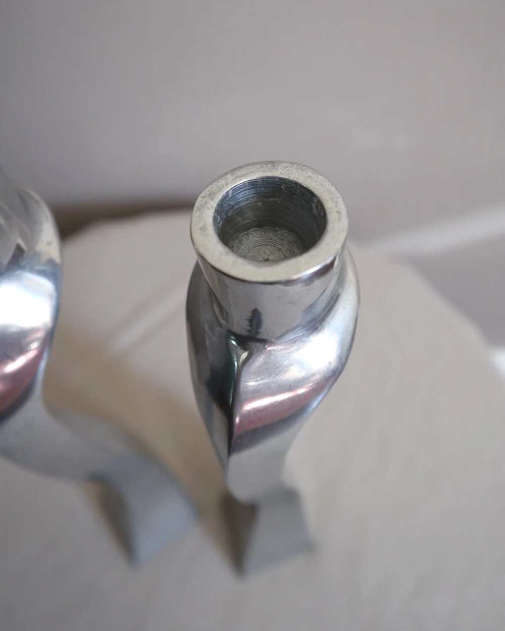 Pair of tall, elegant 1980s Modernist cast aluminium candleholders, likely 'Nessie' style designed by Matthew Hilton.