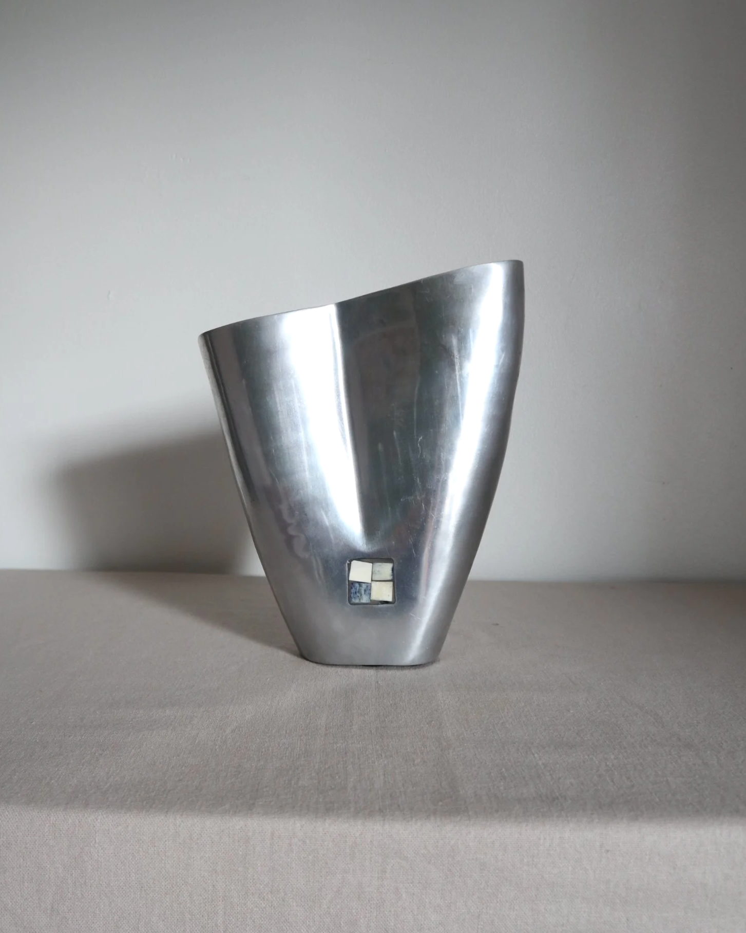 Postmodern heavy cast aluminium vase with sculptural form and four small inset stones. In the style of Anna Efverlund. Circa 1980s. Unsigned.