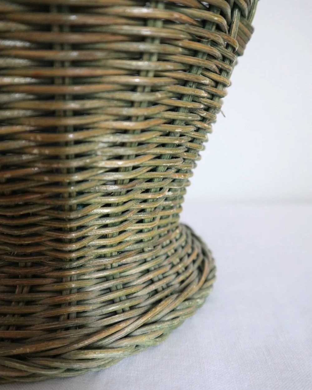 Vintage, large painted green woven wicker table lamp with new, vertical striped cotton lampshade.