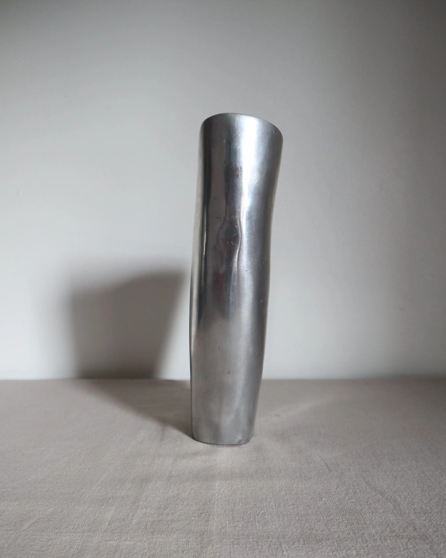 Postmodern heavy cast aluminium vase with sculptural form and four small inset stones. In the style of Anna Efverlund. Circa 1980s. Unsigned.
