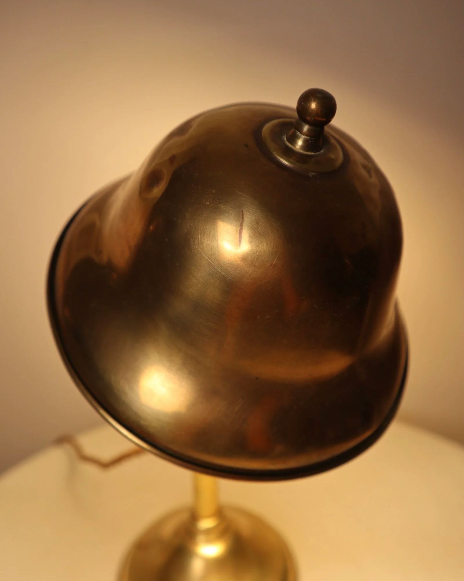 Small, vintage adjustable brass worker's desk lamp. Can be freestanding or attached to the edge of a workbench etc with clamp.