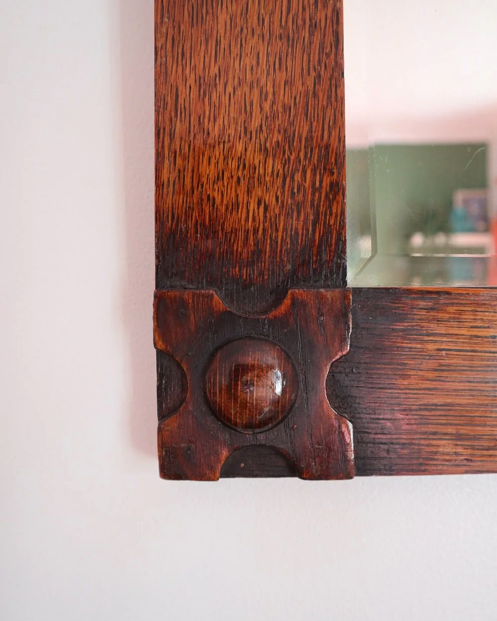 Arts & Crafts square wooden framed mirror with carved corner detailing. Circa 1930s.
