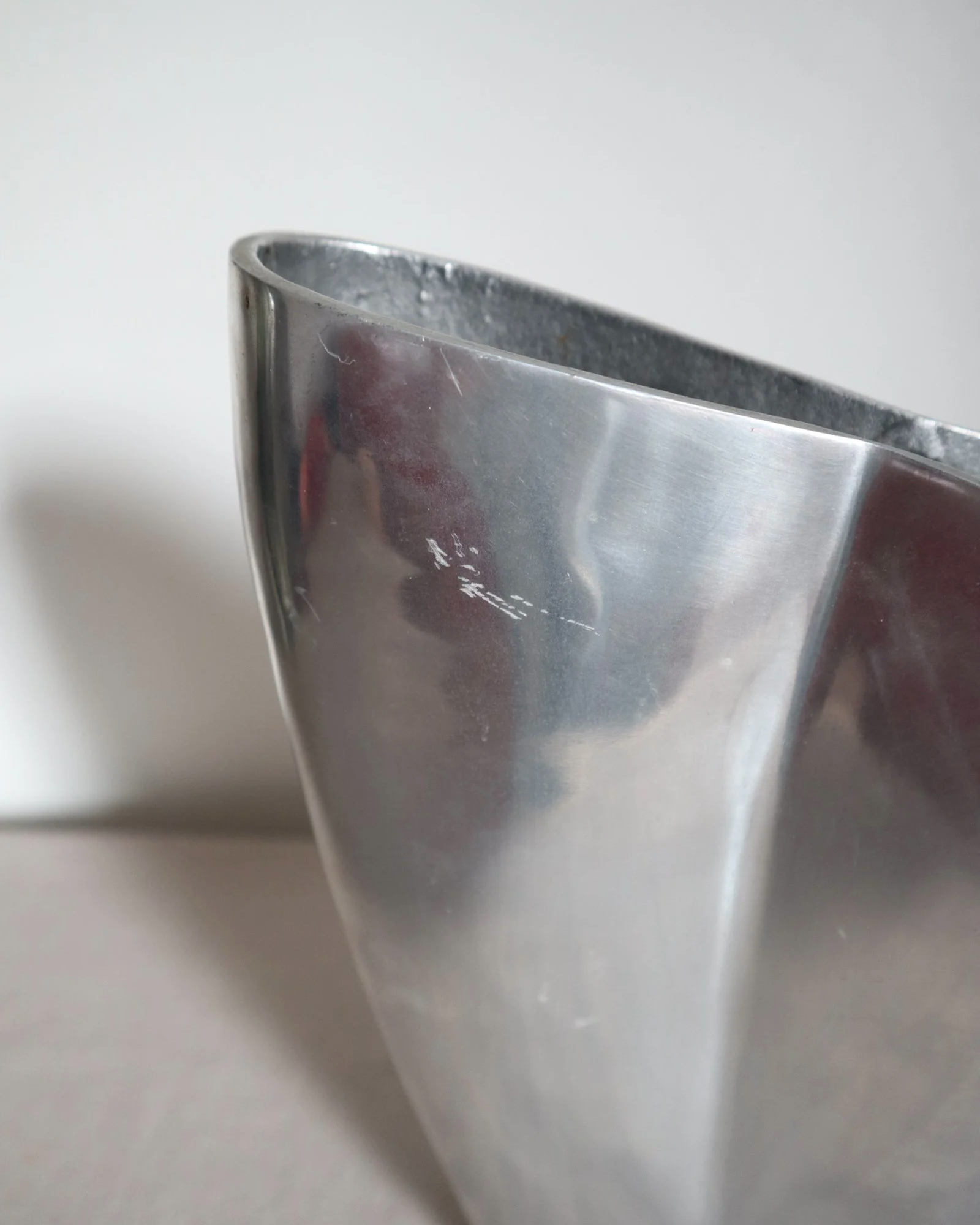 Postmodern heavy cast aluminium vase with sculptural form and four small inset stones. In the style of Anna Efverlund. Circa 1980s. Unsigned.