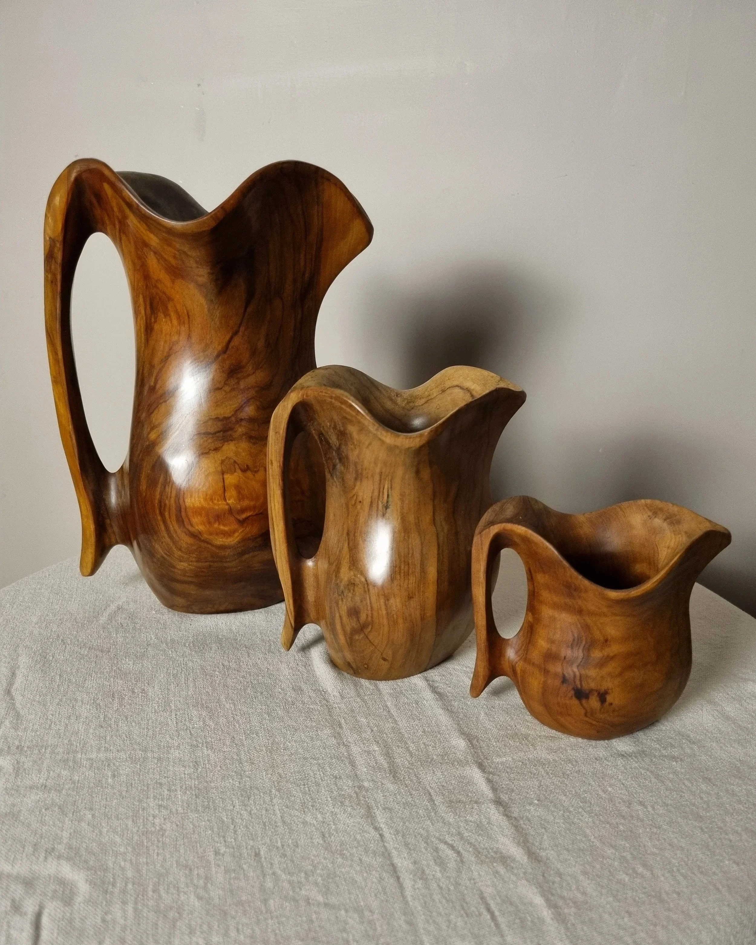 Small mid century hand carved sculptural olivewood jug in the style of Alexandre Noll. Circa 1960s.